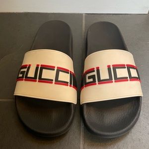 Woman’s rubber Gucci slide sandals..